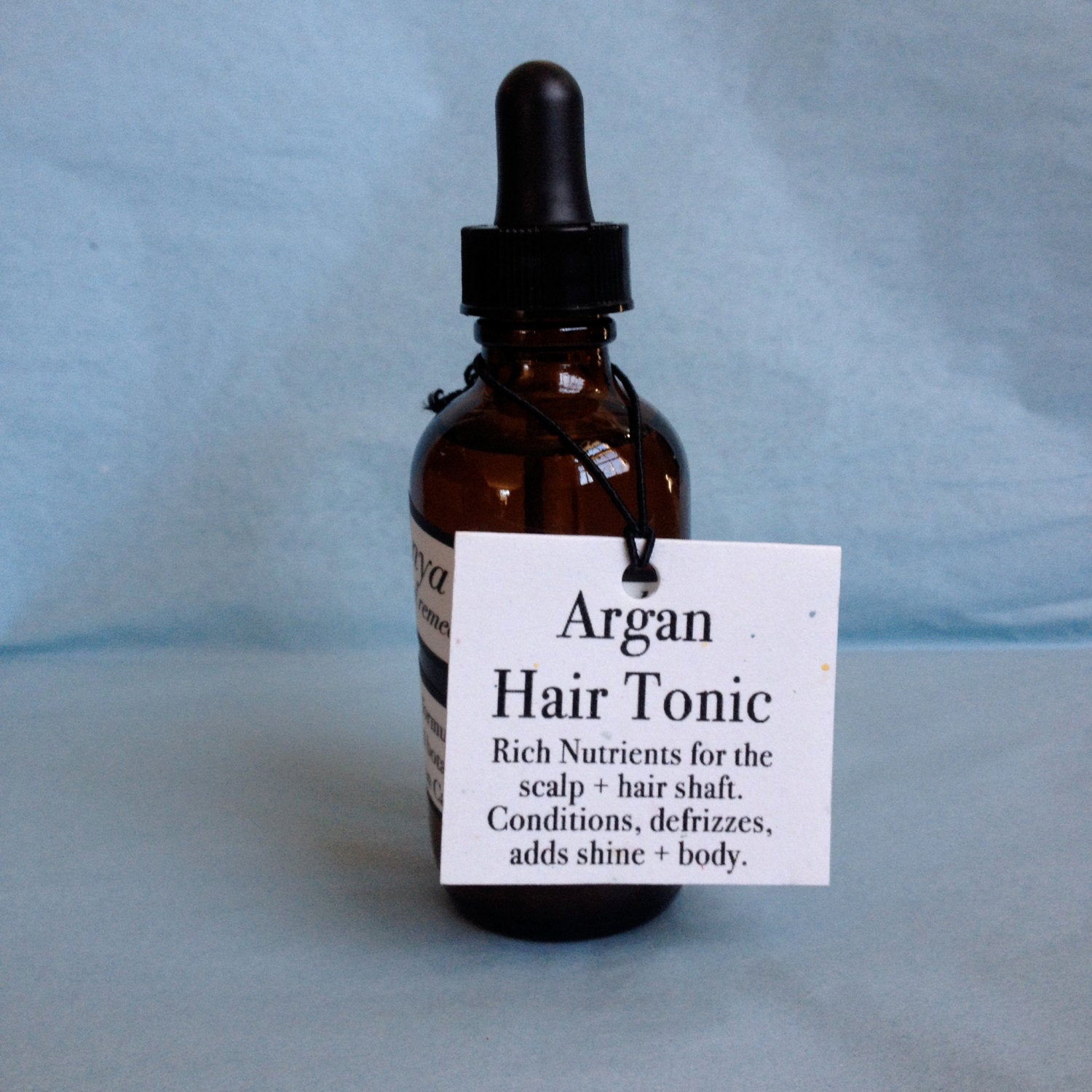 Halo Hair Oil Treatment: Argan, Jojoba, Abyssinian, & Rice Bran Oils.
